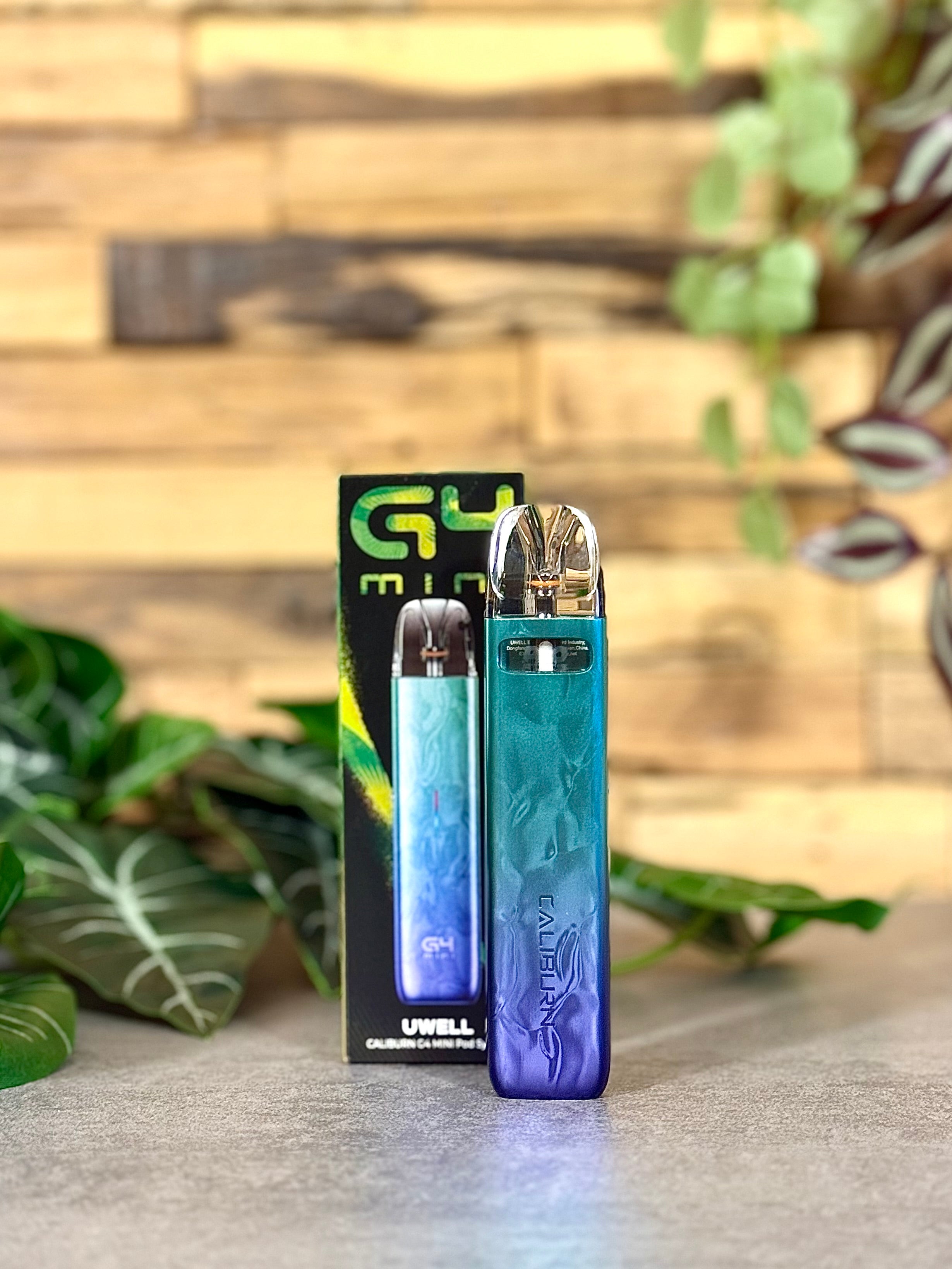 Die Uwell Caliburn G4 Mini | Türkis-Lila - dein bunter Cut mit dem grauen Tabak-Alltag.
