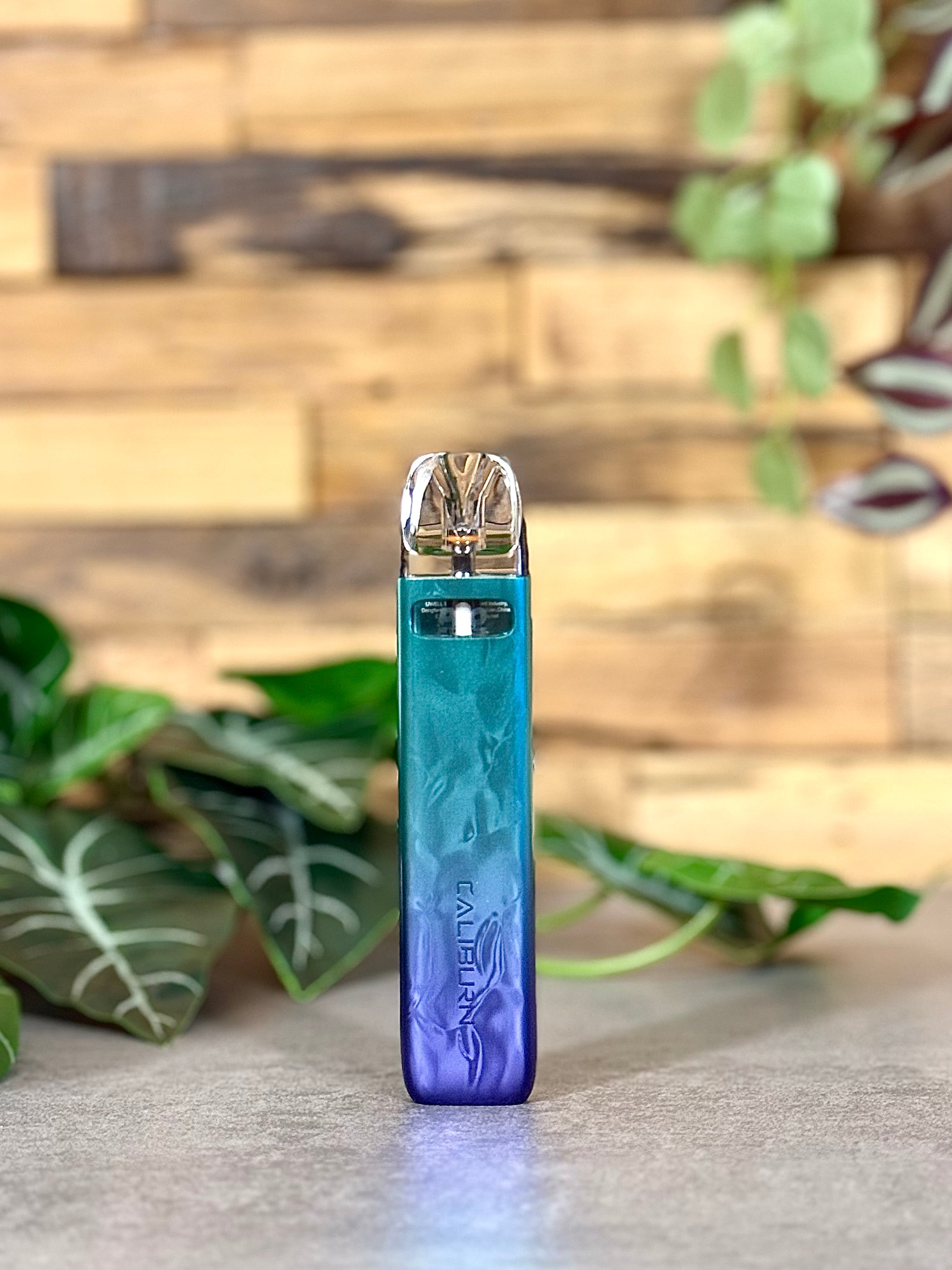 Die Uwell Caliburn G4 Mini | Türkis-Lila - dein bunter Cut mit dem grauen Tabak-Alltag.